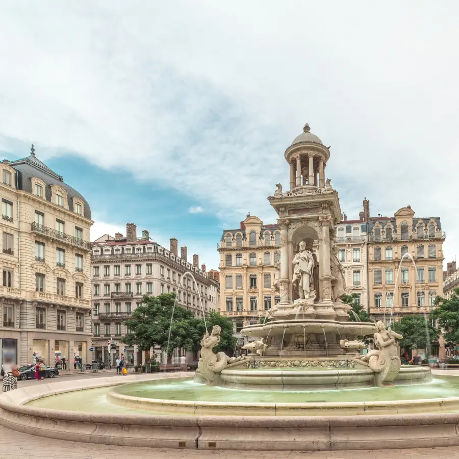 Lyon Walking Tour: Place des Jacobins in Lyon, France, featuring its ornate fountain surrounded by historic European architecture.